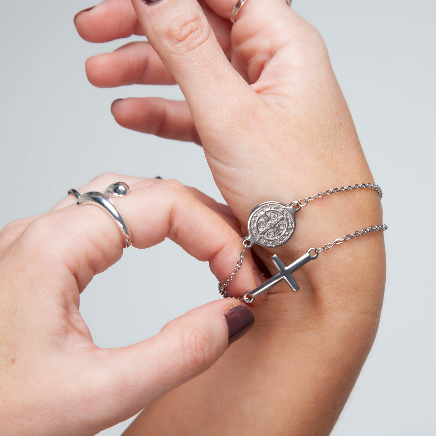 SILVER CROSS AND COIN BRACELET